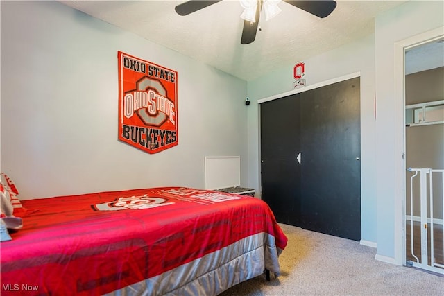 11576 Peach Glen Ave NW, Uniontown, OH 44685 - bedroom with carpet floors, ceiling fan, and a closet