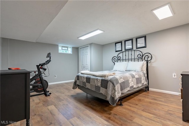 11576 Peach Glen Ave NW, Uniontown, OH 44685 - bedroom featuring wood finished floors and a closet