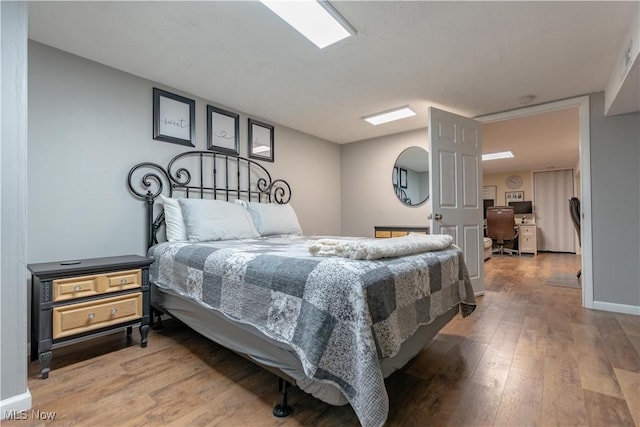 11576 Peach Glen Ave NW, Uniontown, OH 44685 - bedroom with light wood finished floors and a desk