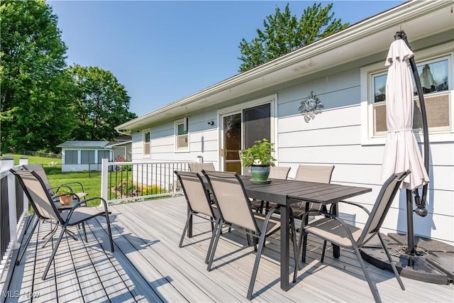 11576 Peach Glen Ave NW, Uniontown, OH 44685 - deck featuring outdoor dining space and a yard