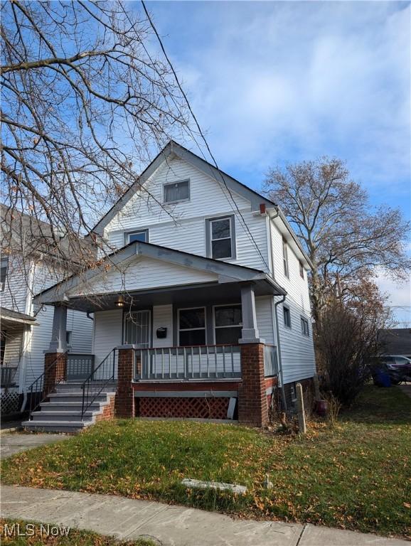 3947 W 22nd St, Cleveland, OH 44109 - american foursquare style home with covered porch and a front yard