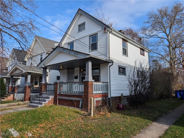 3947 W 22nd St, Cleveland, OH 44109 - american foursquare style home featuring a porch and a front yard