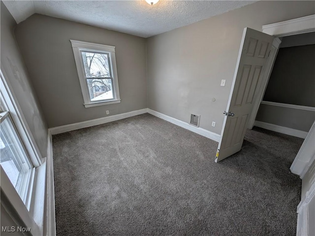 3947 W 22nd St, Cleveland, OH 44109 - carpeted empty room with a textured ceiling and baseboards
