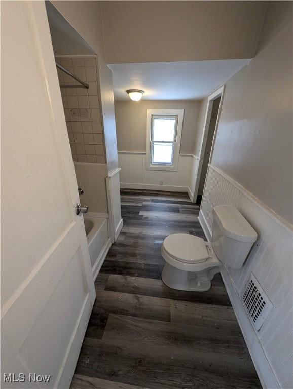 3947 W 22nd St, Cleveland, OH 44109 - full bathroom featuring wood finished floors, wainscoting, and shower / bath combination