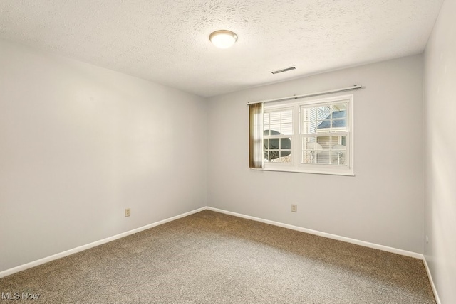 3820 Twin Pines Dr Unit 8A, Uniontown, OH 44685 - unfurnished room with carpet flooring and a textured ceiling