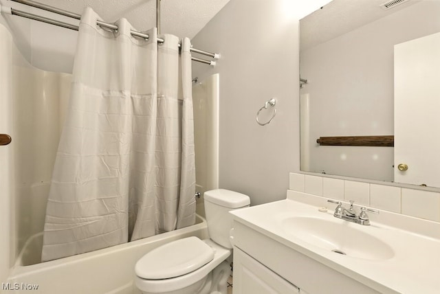 3820 Twin Pines Dr Unit 8A, Uniontown, OH 44685 - bathroom with shower / bath combo with shower curtain, vanity, and a textured ceiling