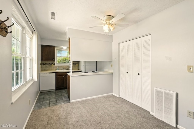 3820 Twin Pines Dr Unit 8A, Uniontown, OH 44685 - kitchen featuring white appliances, ceiling fan, carpet floors, light countertops, and decorative backsplash