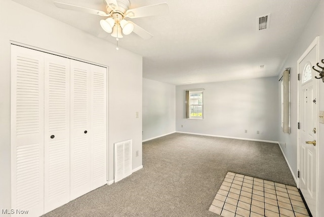 3820 Twin Pines Dr Unit 8A, Uniontown, OH 44685 - unfurnished bedroom featuring light carpet, a closet, and a ceiling fan