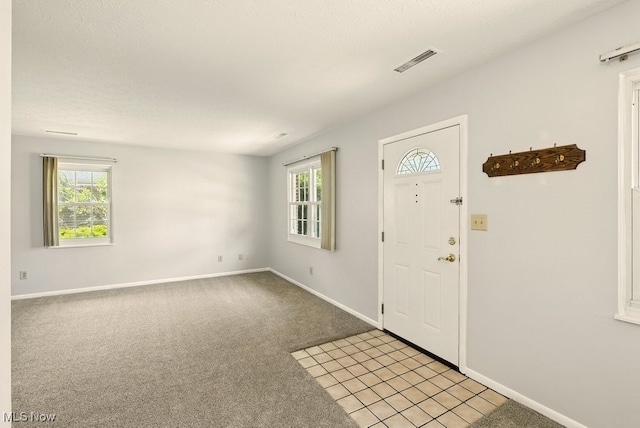 3820 Twin Pines Dr Unit 8A, Uniontown, OH 44685 - entrance foyer featuring baseboards and light carpet