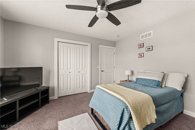 12187 Bexley Dr, Grafton, OH 44044 - carpeted bedroom with a closet, a ceiling fan, and a textured ceiling