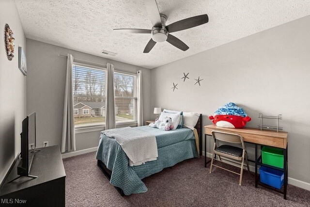 12187 Bexley Dr, Grafton, OH 44044 - bedroom with a textured ceiling, carpet flooring, and a ceiling fan