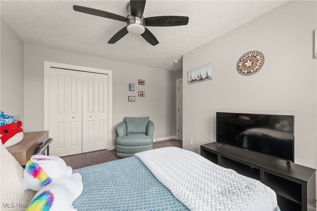 12187 Bexley Dr, Grafton, OH 44044 - carpeted bedroom with a closet, a textured ceiling, and a ceiling fan