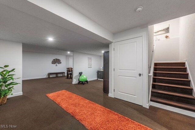 12187 Bexley Dr, Grafton, OH 44044 - finished basement with dark carpet and stairs