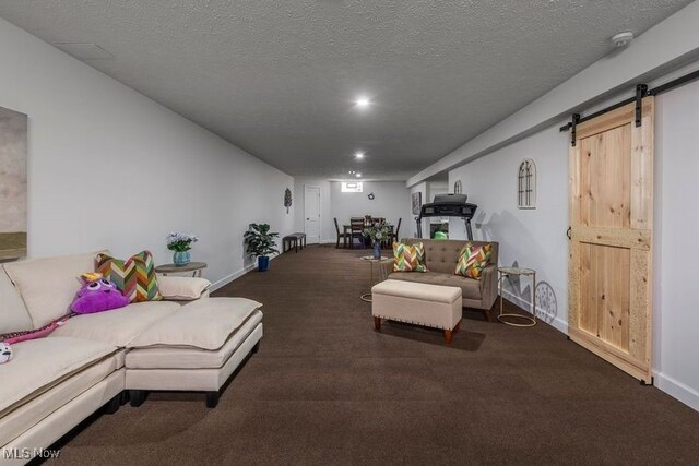 12187 Bexley Dr, Grafton, OH 44044 - living room featuring carpet flooring, a barn door, recessed lighting, and a textured ceiling