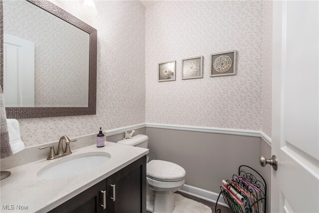 12187 Bexley Dr, Grafton, OH 44044 - half bath with wallpapered walls and vanity