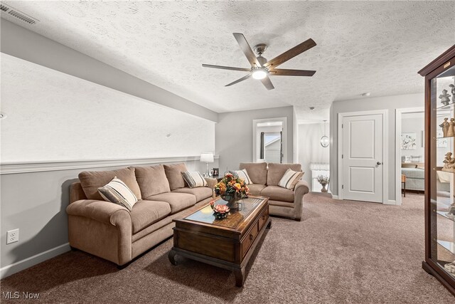 12187 Bexley Dr, Grafton, OH 44044 - living area featuring a ceiling fan, carpet, and a textured ceiling
