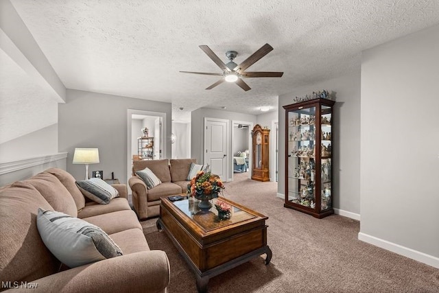 12187 Bexley Dr, Grafton, OH 44044 - carpeted living area featuring a ceiling fan and a textured ceiling