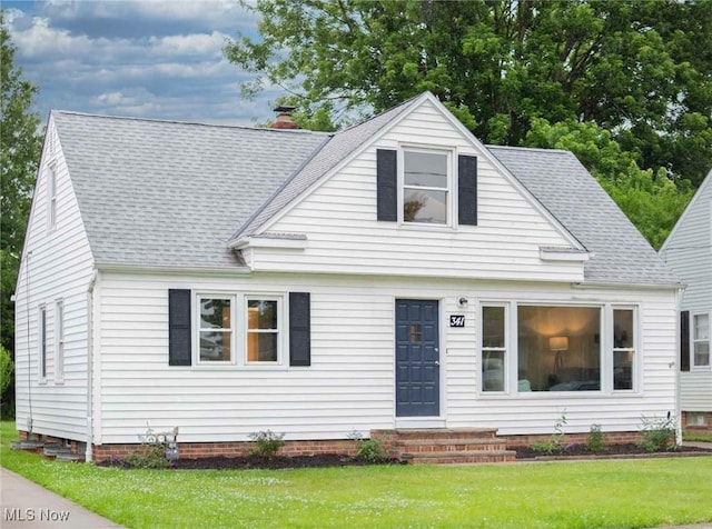 341 Clarmont Rd, Willowick, OH 44095 - view of front of house with a front yard, a shingled roof, and a chimney