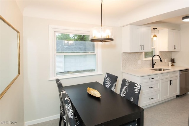 341 Clarmont Rd, Willowick, OH 44095 - dining area with light tile patterned floors and baseboards