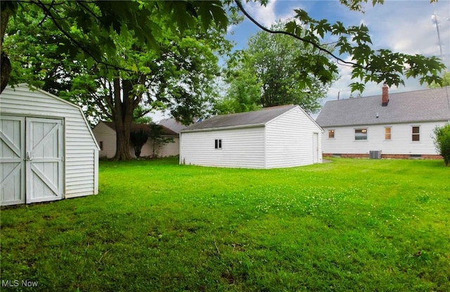 341 Clarmont Rd, Willowick, OH 44095 - view of green lawn featuring a shed