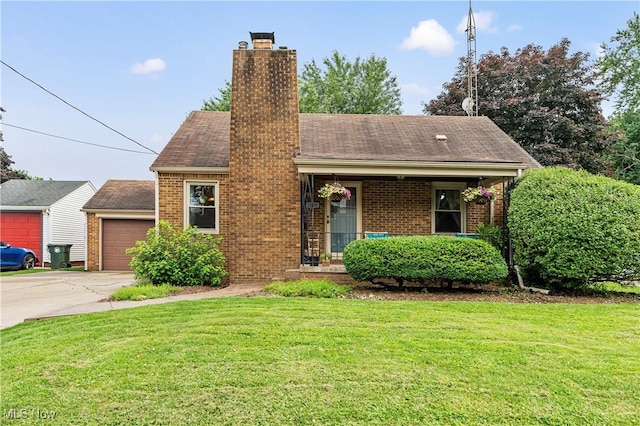 2026 34th St NW, Canton, OH 44709 - view of front facade featuring brick siding, a front yard, driveway, a chimney, and covered porch