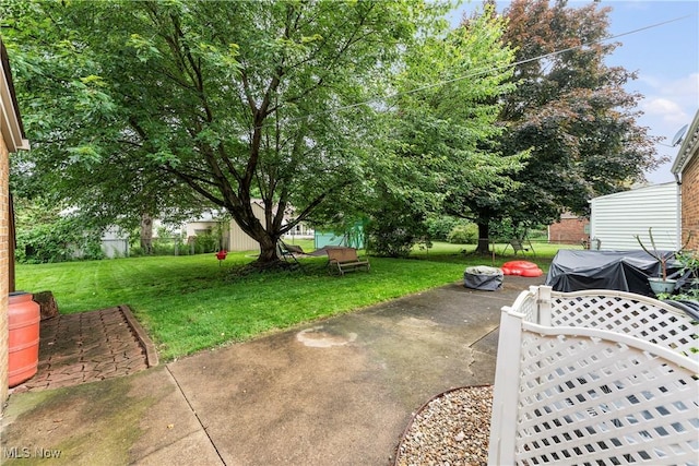 2026 34th St NW, Canton, OH 44709 - view of green lawn featuring a patio area