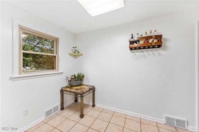 2026 34th St NW, Canton, OH 44709 - doorway featuring baseboards and light tile patterned floors