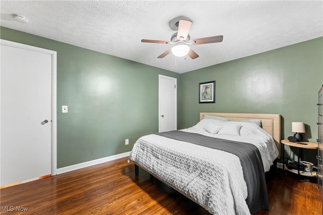 2026 34th St NW, Canton, OH 44709 - bedroom with wood finished floors, a textured ceiling, and ceiling fan