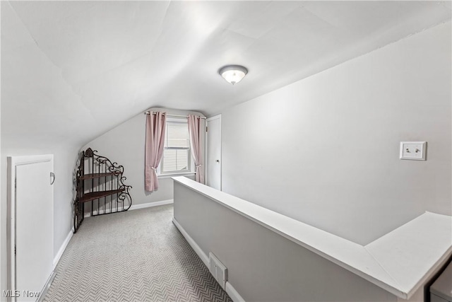 2026 34th St NW, Canton, OH 44709 - hall with light carpet and vaulted ceiling