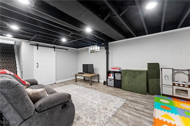 2026 34th St NW, Canton, OH 44709 - finished basement featuring wood finished floors and a barn door