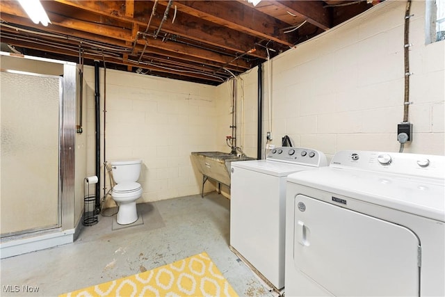 2026 34th St NW, Canton, OH 44709 - laundry room featuring separate washer and dryer and concrete block wall