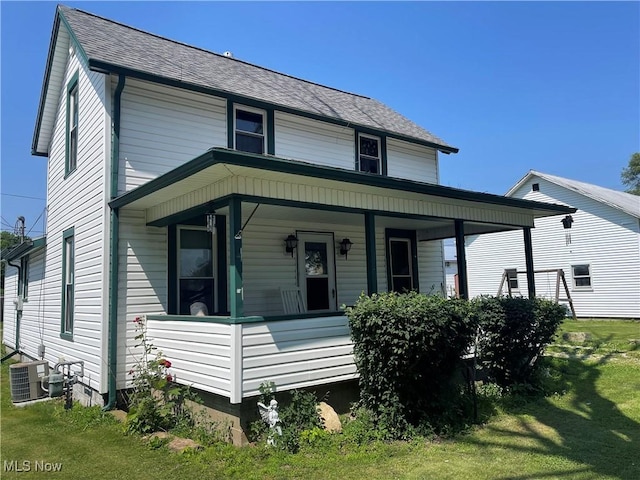 320 E Union Ave, West Lafayette, OH 43845 - view of front facade featuring covered porch, a front yard, and roof with shingles