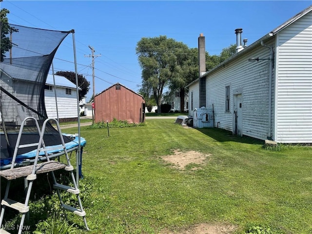 320 E Union Ave, West Lafayette, OH 43845 - view of green lawn featuring a trampoline