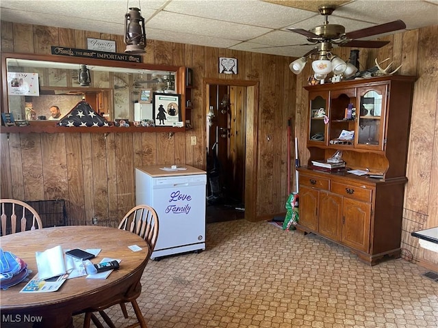 320 E Union Ave, West Lafayette, OH 43845 - dining space with wood walls and a ceiling fan