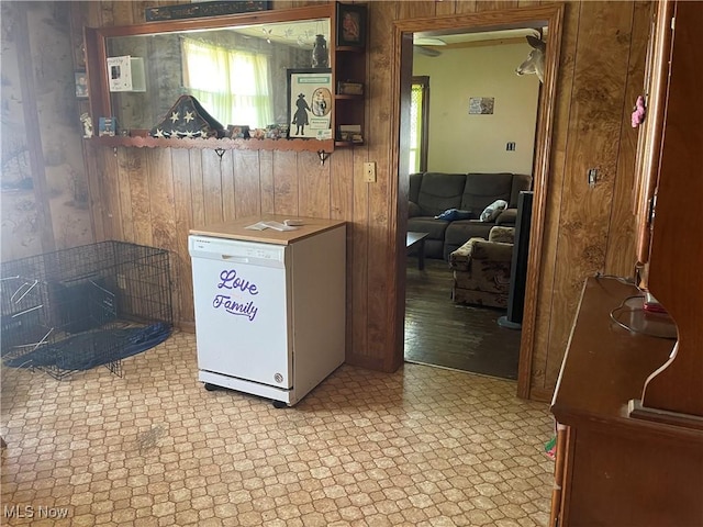 320 E Union Ave, West Lafayette, OH 43845 - kitchen featuring wood walls, tile patterned floors, and fridge