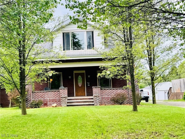741 Jennings Ave, Salem, OH 44460 - american foursquare style home featuring a porch and a front lawn