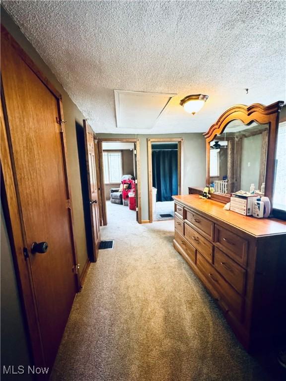 741 Jennings Ave, Salem, OH 44460 - corridor with a textured ceiling and light carpet