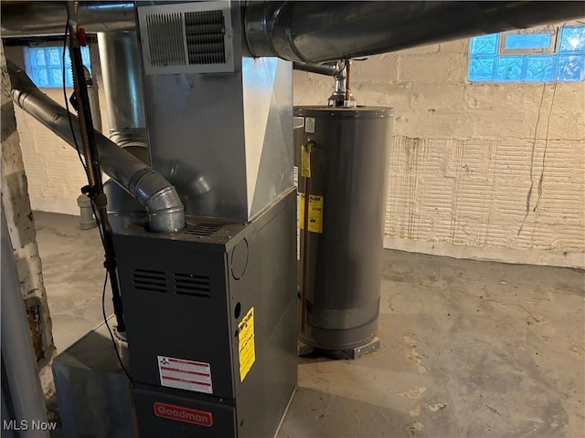 713 Virginia Ave, Akron, OH 44306 - utility room featuring gas water heater and heating unit