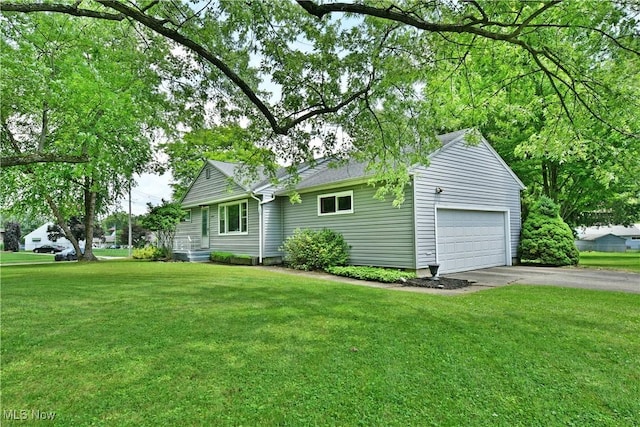 2803 Brunswick Rd, Youngstown, OH 44511 - view of front of home with a garage, driveway, and a front lawn