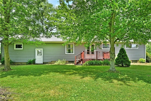 2803 Brunswick Rd, Youngstown, OH 44511 - back of property featuring a wooden deck and a yard