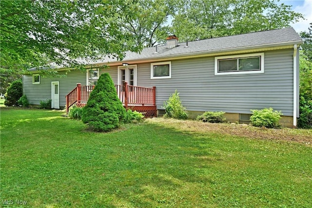 2803 Brunswick Rd, Youngstown, OH 44511 - back of house featuring a deck, a yard, a chimney, and crawl space