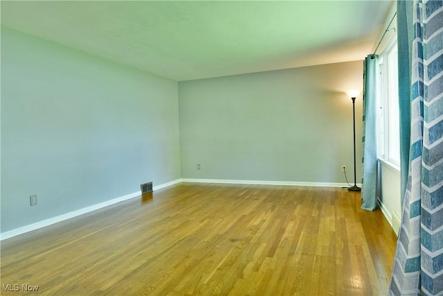 2803 Brunswick Rd, Youngstown, OH 44511 - spare room featuring wood finished floors and plenty of natural light