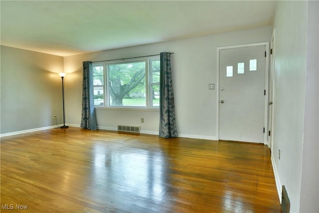 2803 Brunswick Rd, Youngstown, OH 44511 - unfurnished living room with wood finished floors and baseboards