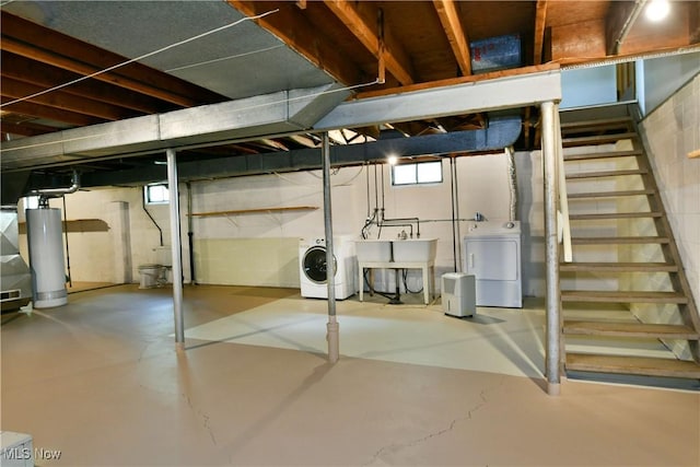 2803 Brunswick Rd, Youngstown, OH 44511 - below grade area with washer and clothes dryer, water heater, and stairs