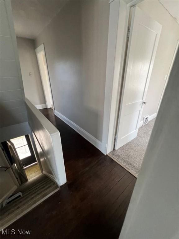 836 E 236th St, Euclid, OH 44123 - corridor with dark wood finished floors and baseboards