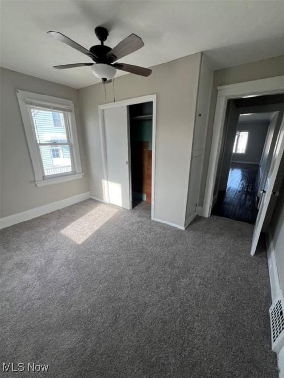 836 E 236th St, Euclid, OH 44123 - unfurnished bedroom featuring carpet flooring, ceiling fan, and a closet