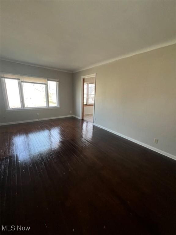 836 E 236th St, Euclid, OH 44123 - spare room with dark wood finished floors and ornamental molding