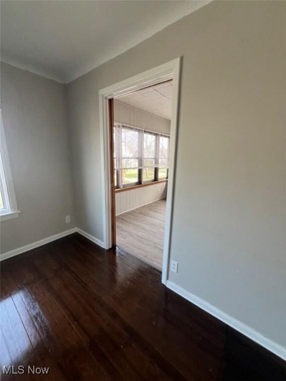 836 E 236th St, Euclid, OH 44123 - unfurnished room with dark wood-type flooring and baseboards