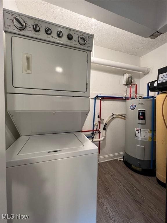 213 Turner Dr, Chardon, OH 44024 - washroom featuring stacked washer and clothes dryer, electric water heater, and dark wood finished floors