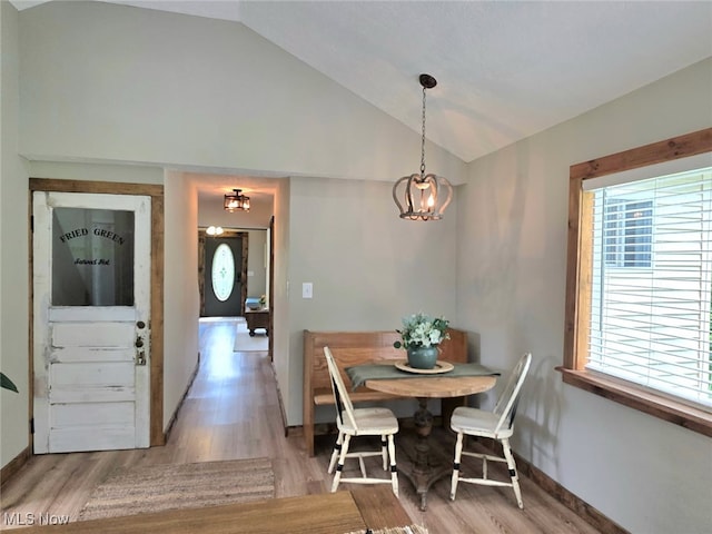 12779 State Route 700, Hiram, OH 44234 - dining area with vaulted ceiling, a chandelier, and light wood finished floors